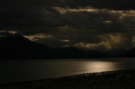 Pangong Tso under a partial moonlit night sky